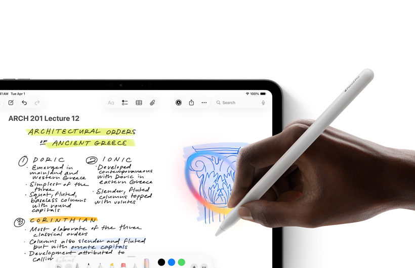 A hand holding Apple Pencil draws a circle around a sketch in the Notes app on iPad.