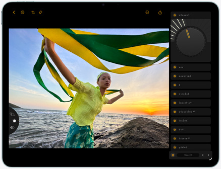 iPad Air, front exterior, editing photo of a person holding green and yellow fabric against a sunset beach backdrop, with editing tools visible on the right side