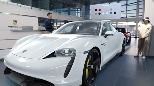 A customer in a Porsche showroom wearing Apple Vision Pro views a 3D projection of a sports car and talks with an employee