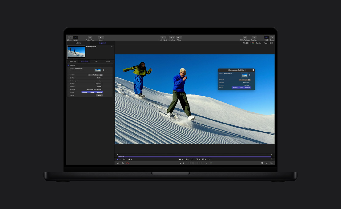 MacBook Pro 16, couple running down sand dune, demo of image stabilisation