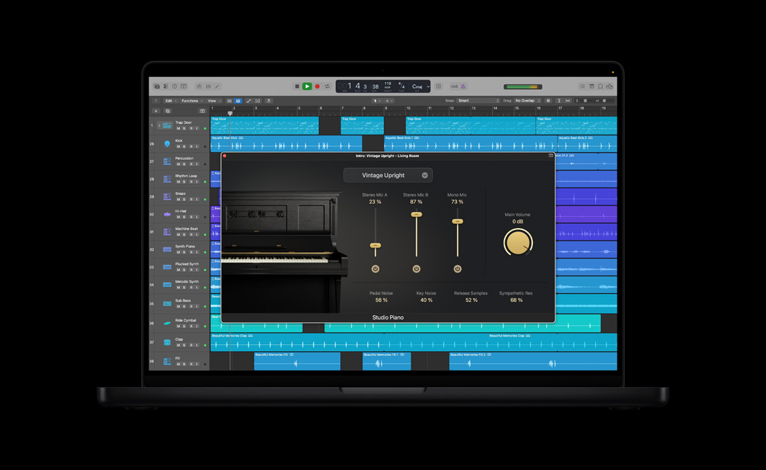 MacBook Pro 16″ screen showing Studio Piano, Intro: Vintage Upright - Living Room window with black piano on the left, dials and controls