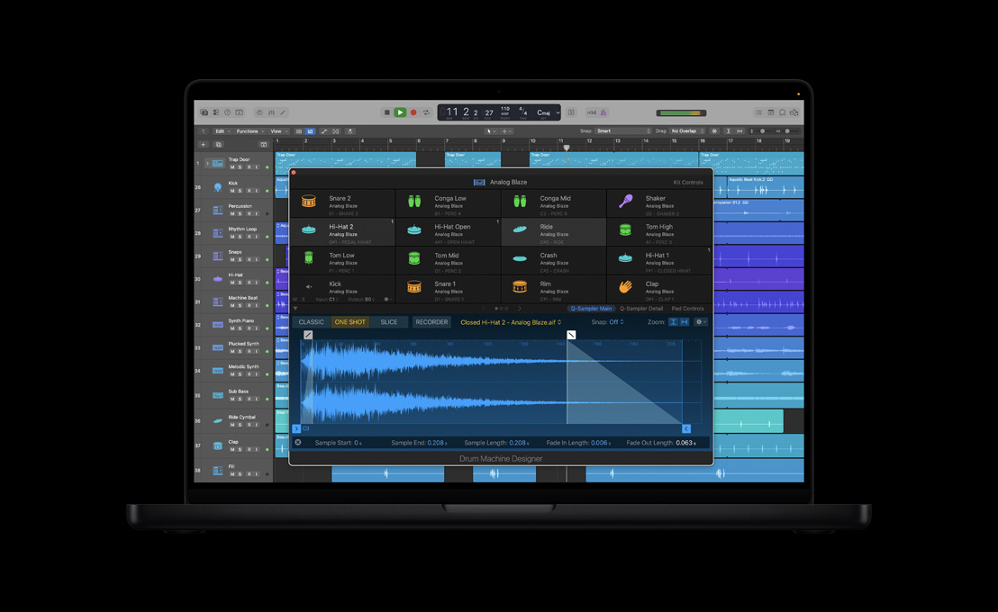 MacBook Pro 16″ screen showing Drum Machine Designer, kit controls, Analog Blaze window with sound waves and four rows of various instruments