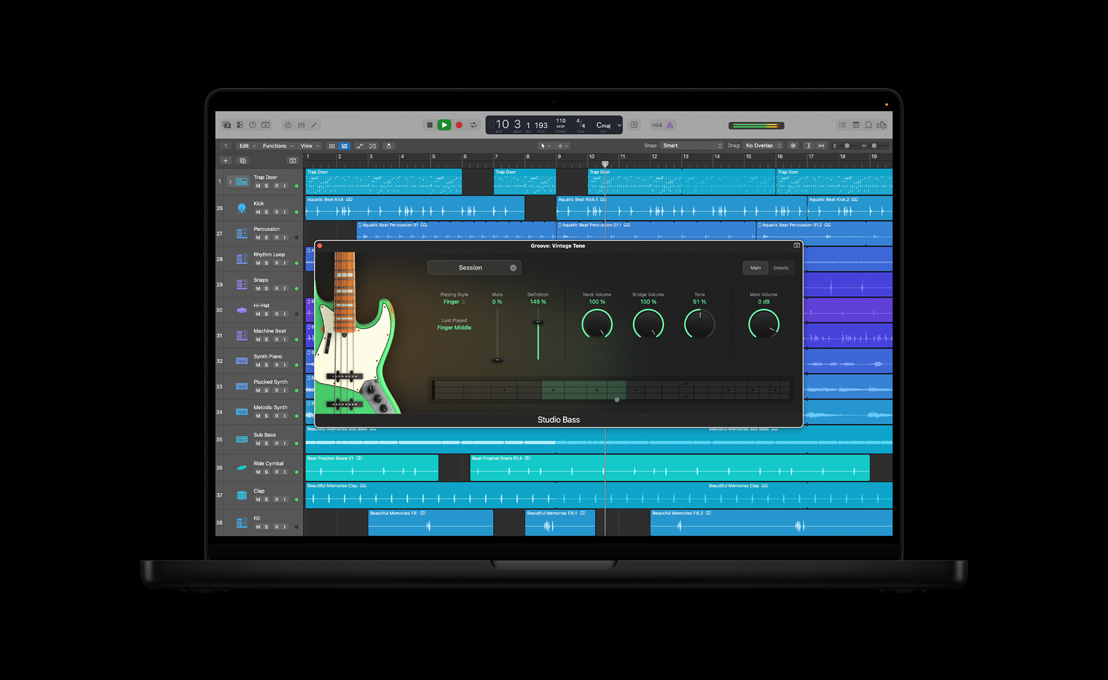 MacBook Pro 16″ screen showing Studio Bass, Groove: Vintage Tone window with green electric guitar on the left, main session dials