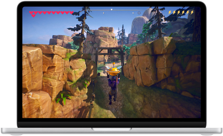 MacBook Neo, silver colour, screen shows a scene from the game Oceanhorn 3