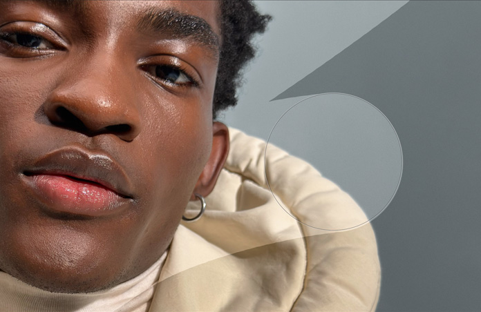 Close-up photo of man’s face, retouching tools