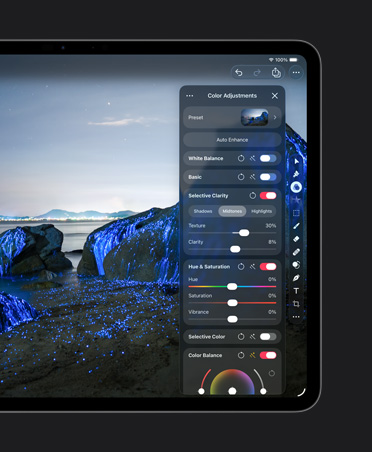 iPad Pro 13″ screen, photo of boulders on beach with blue glows, colour adjustments tools